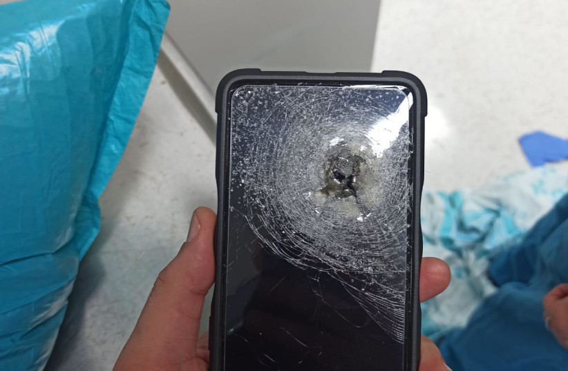  The phone that took the bullet for the patient. (photo credit: RAMBAM HEALTH CARE CAMPUS)