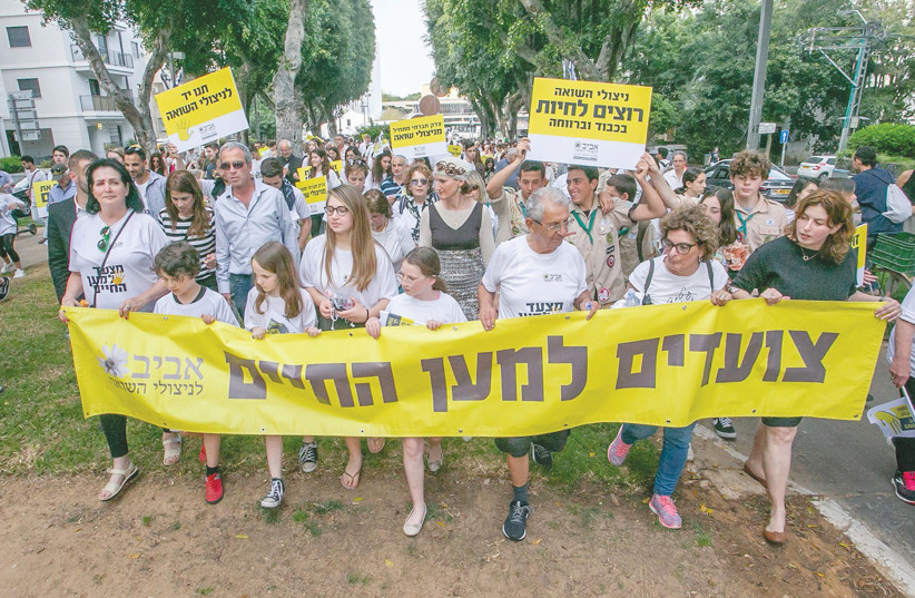  A MARCH takes place in Tel Aviv calling to enshrine the socioeconomic well-being and dignity of Holocaust survivors.  (photo credit: Benny Peled)