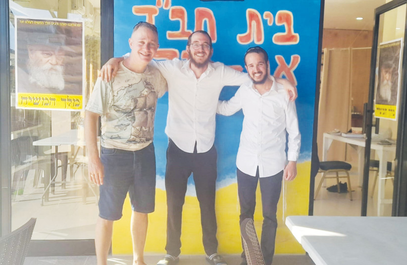  THE WRITER (left) poses with Dovi Hershkop (center) and Mendel Magur at Chabad House El Nido.  (photo credit: Lee Saunders)