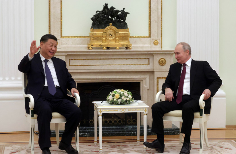  Russian President Vladimir Putin and Chinese President Xi Jinping attend a meeting at the Kremlin in Moscow, Russia, March 20, 2023 (photo credit: Sputnik/Sergei Karpukhin/Pool via REUTERS)