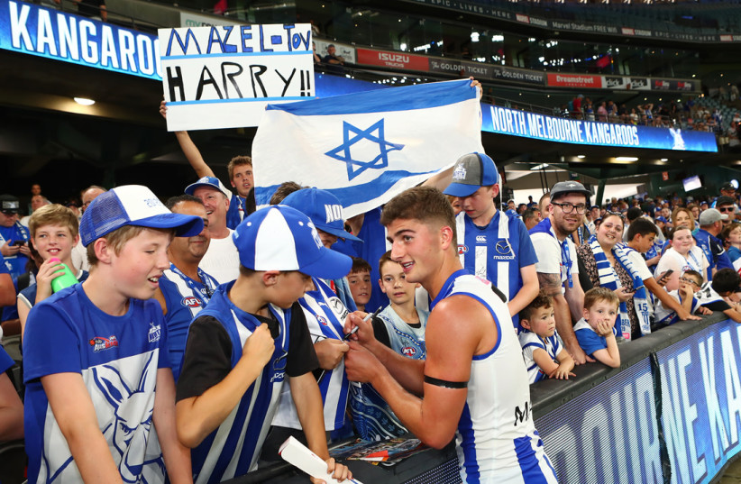  Israeli flags and signs shown at AFL games in support of Harry Sheezel. (photo credit: PETER HASKIN/AUSTRALIAN JEWISH NEWS)