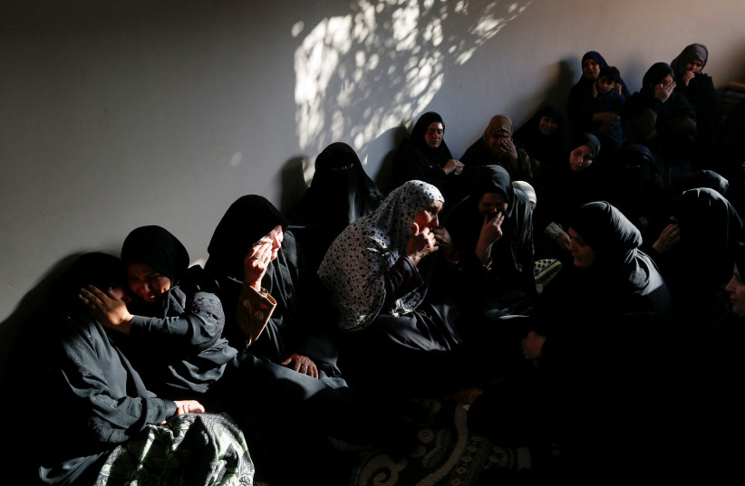  Palestinians relatives of Sabreen Abu Jazar, who died when a boat carrying migrants sank offshore Greece, mourn in her family home in Gaza Strip March 3, 2023 (credit: REUTERS)
