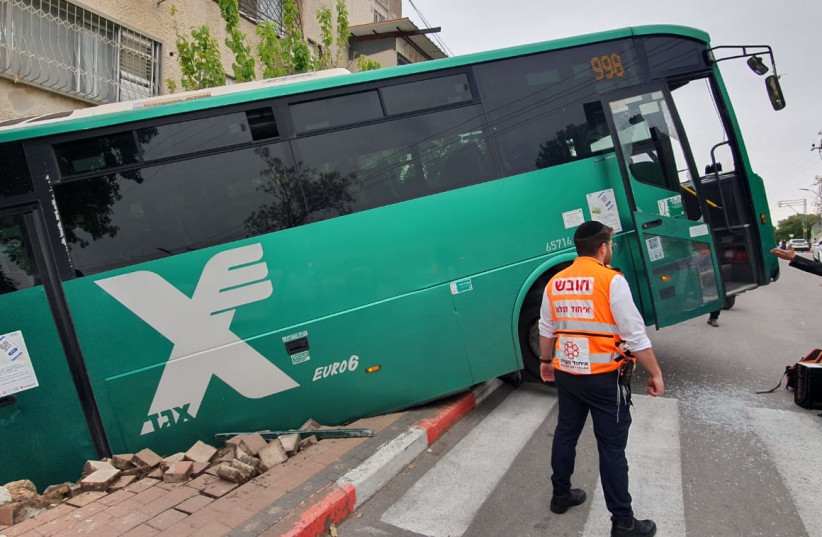 Bus slides off road near Haifa on March 22, 2023. (photo credit: HATZALAH UNITED)