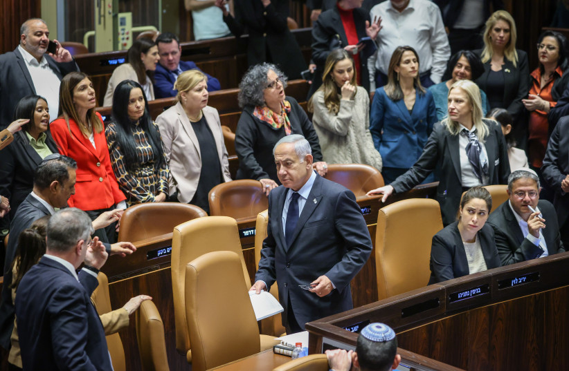  Israeli MKs are seen in the Knesset plenum following a day of voting on March 22, 2023 (photo credit: NOAM MOSKOVITZ/KNESSET)
