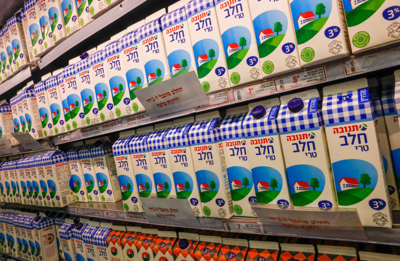 Milk, with a sign reading 'the milk is limited to 2 cartons per customer,' is seen in a Jerusalem supermarket on March 22, 2023  (credit: MARC ISRAEL SELLEM/THE JERUSALEM POST)