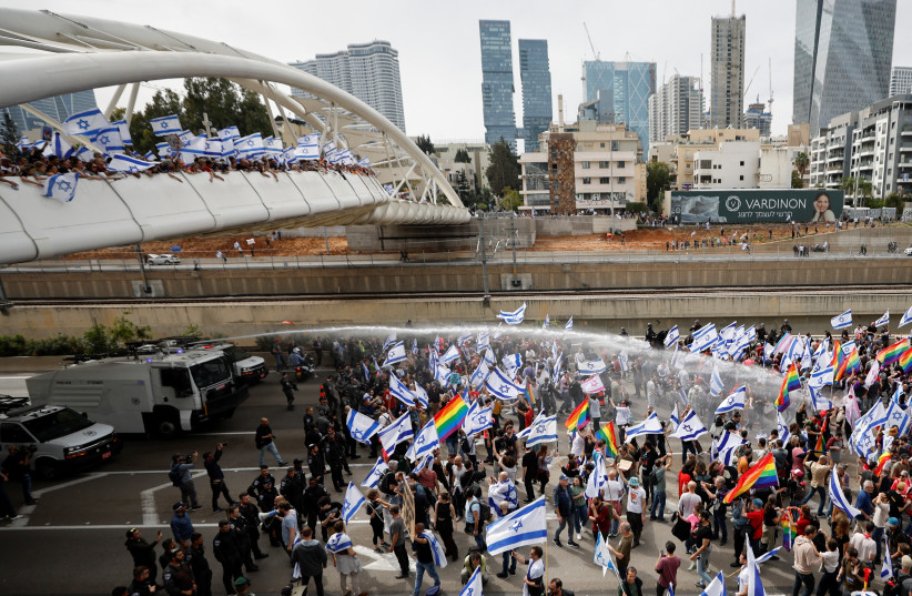  Demonstrators attend the "Day of Paralysis" protest, as Prime Minister Benjamin Netanyahu's coalition government presses on with its judicial overhaul, in Tel Aviv, Israel March 23, 2023 (photo credit: REUTERS/Ronen Zvulun)
