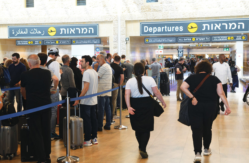  PASSENGERS AT Ben-Gurion Airport get ready to leave Israel.  (photo credit: GILI YAARI/FLASH90)
