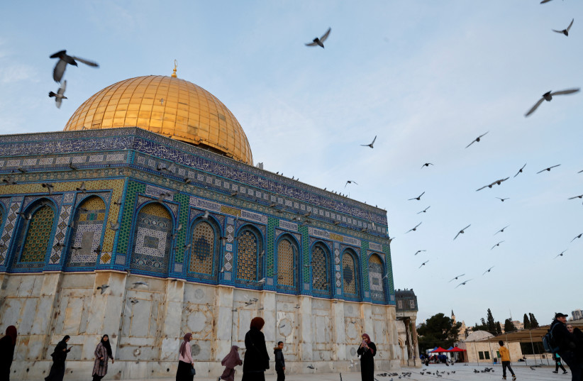  A general view of the Dome of the Rock on the compound known to Muslims as the Noble Sanctuary and to Jews as the Temple Mount, as Palestinians attend the first Friday of the holy month of Ramadan, in Jerusalem's Old City March 24, 2023. (photo credit: AMMAR AWAD/REUTERS)