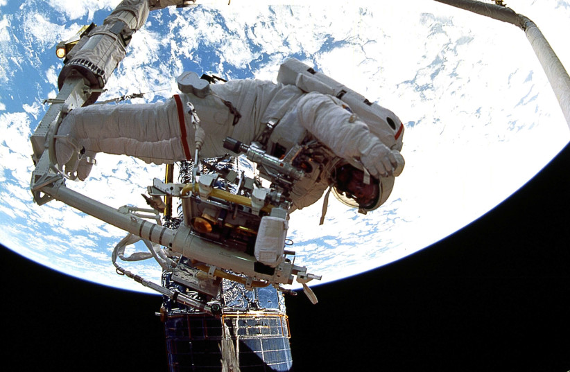  Dr. Jeff Hoffman in space. (photo credit: COURTESY/SPACE TORAH PROJECT)