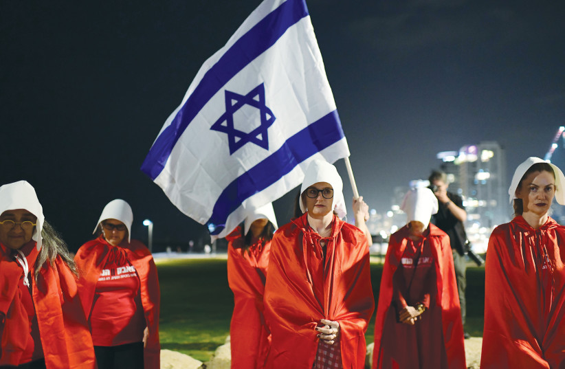  PROTESTERS DRESS as characters from ‘The Handmaid’s Tale,’ to show their opposition to the government’s planned judicial overhaul, in Tel Aviv, earlier this month.  (photo credit: TOMER NEUBERG/FLASH90)