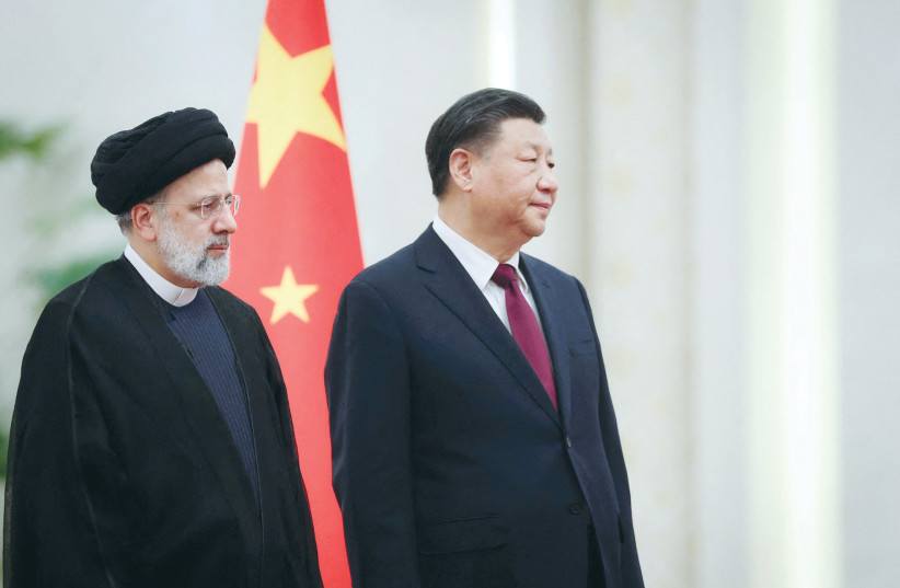  IRANIAN PRESIDENT Ebrahim Raisi meets Chinese President Xi Jinping in Beijing, last month. With attention focused on the US-Chinese rivalry, Iran is making steady progress toward nuclear capability, says the writer.  (photo credit: IRAN'S PRESIDENTIAL WEBSITE/WEST ASIA NEWS AGENCY/REUTERS)