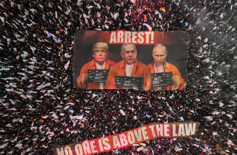 No one is above the law: The Umbrella Movement of Resistance against Dictatorship unfurls a banner of Netanyahu, Putin, and Trump in central Tel Aviv to kick off 12th week of protests.