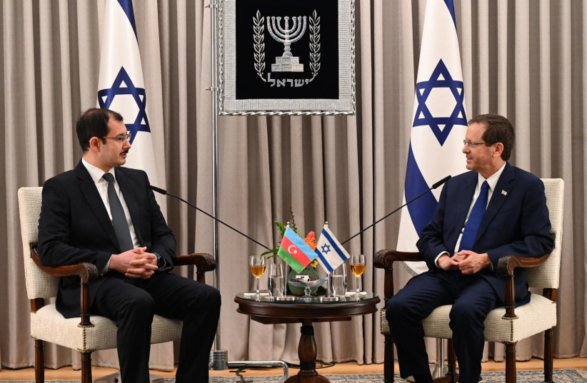 Azerbaijan's ambassador to Israel, Mukhtar Mammadov, presents his credentials to President Isaac Herzog on March 26, 2023. (credit: CHAIM TZACH/GPO)
