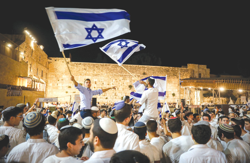  CELEBRATIONS TAKE place at the Western Wall marking Jerusalem Day, last May. Israel scored high because our dedication to Zionism or religious beliefs makes life here meaningful and satisfying. (credit: NOAM REVKIN FENTON/FLASH90)