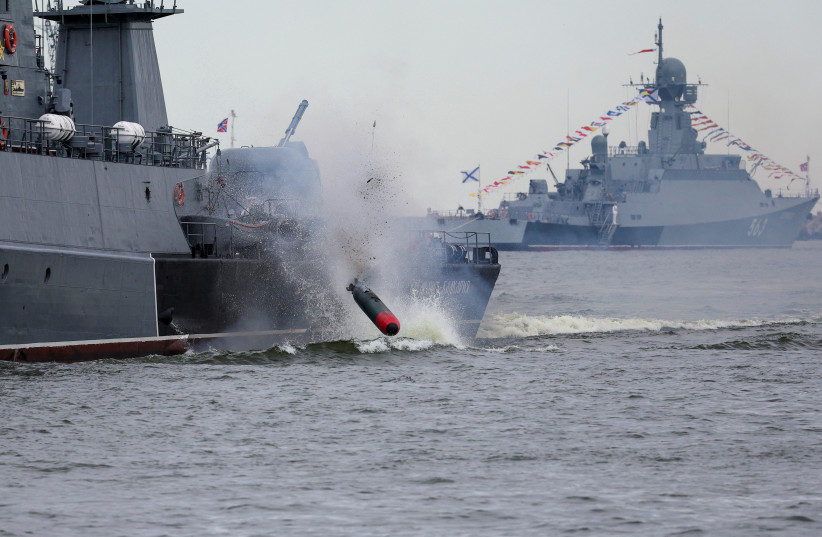  A torpedo is launched by a Russian warship during a parade marking Navy Day in Baltiysk in the Kaliningrad region, Russia July 31, 2022. (photo credit: REUTERS/VITALY NEVAR)