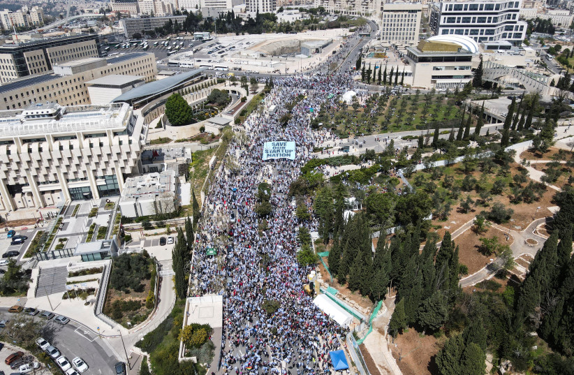  An aerial view shows protesters attending a demonstration against the Israeli government's judicial overhaul, in Jerusalem, March 27, 2023 (credit: REUTERS/STRINGER)