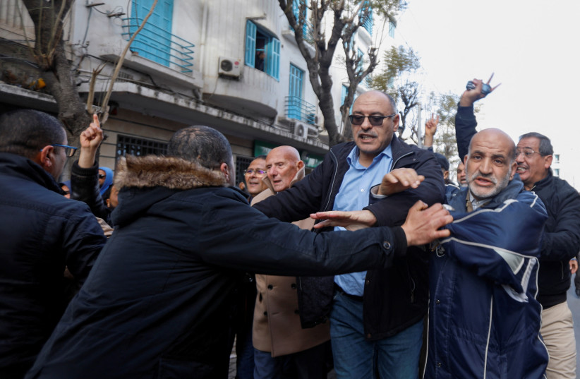  Demonstrators scuffle with police during a protest over the arrest of some of Salvation Front opposition coalition leaders and other prominent critics of the president, in Tunis, Tunisia March 5, 2023. (photo credit: REUTERS/ZOUBEIR SOUISSI)