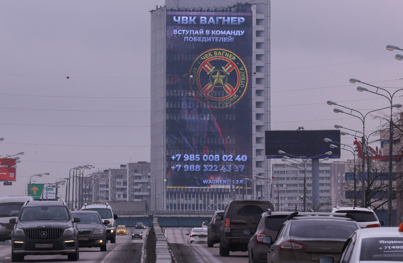 An advertising screen, which promotes to join Wagner private mercenary group, is on display on the facade of a building in Moscow, Russia, March 27, 2023. A slogan on the screen reads: ''Join the team of victors!'' (credit: EVGENIA NOVOZHENINA/REUTERS)