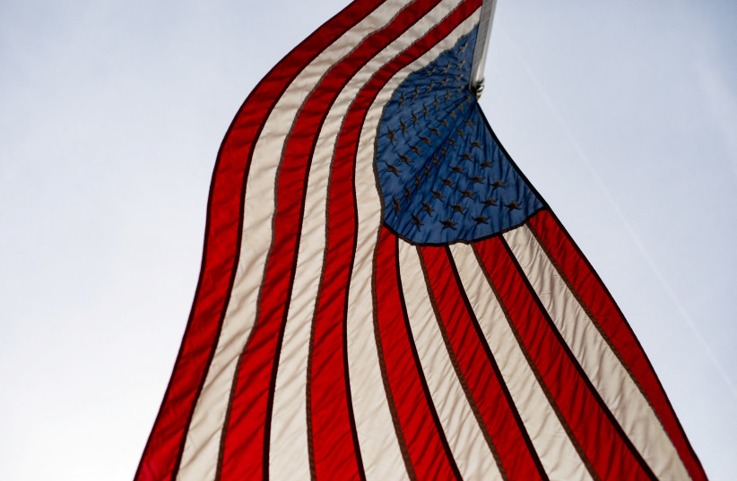 An American flag blows in the wind in Hillsdale, Michigan, U.S., February 8, 2023