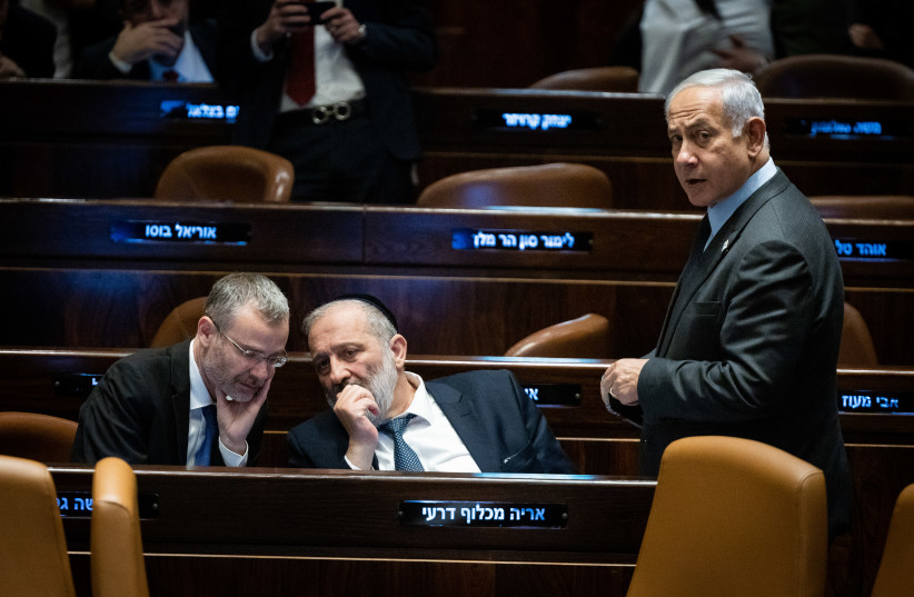  Prime Minister Benjamin Netanyahu with Justice Minister Yariv Levin and MK Arye Deri in the Knesset on March 27, 2023 (photo credit: YONATAN SINDEL/FLASH90)