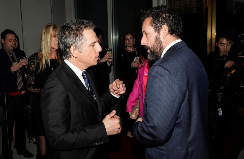 Ben Stiller greets Adam Sandler before actor and comedian Sandler is awarded the Mark Twain Prize for American Humor at the Kennedy Center in Washington, US, March 19, 2023. (photo credit: REUTERS/JOSHUA ROBERTS)