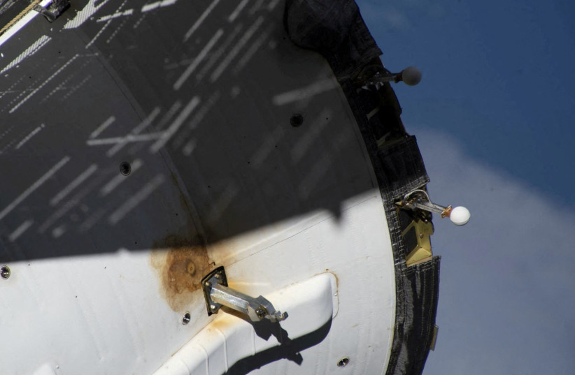  A view shows external damage believed to have caused a loss of pressure in the cooling system of the Soyuz MS-22 spacecraft docked to the International Space Station (ISS), in this image released February 13, 2023. (photo credit: REUTERS)