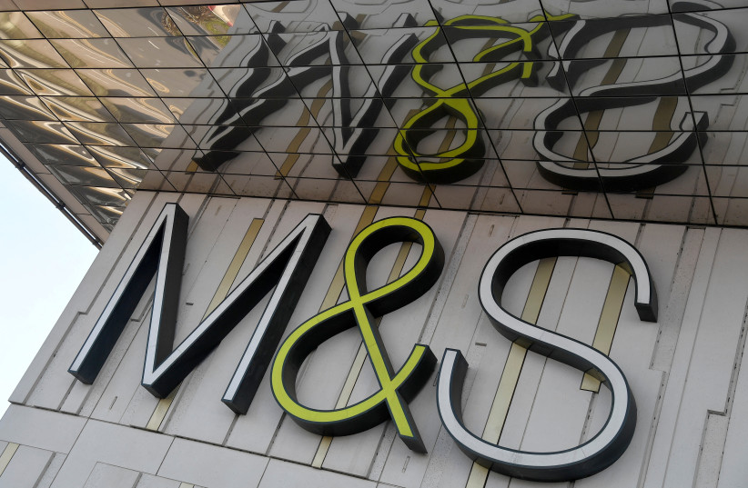  FILE PHOTO: A logo of food and clothes' retailer Marks and Spencer (M&S) is seen at a branch in London, Britain March 10, 2022. (photo credit: TOBY MELVILLE/REUTERS)
