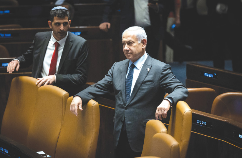  PRIME MINISTER Benjamin Netanyahu observes the Knesset plenum proceedings, on Monday. (photo credit: YONATAN SINDEL/FLASH90)