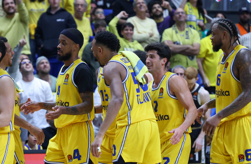  MACCABI TEL AVIV players were all smiles toward the conclusion of the club’s 111-80 Euroleague victory over Bologna on Tuesday night at Yad Eliyahu (credit: DANNY MARON)