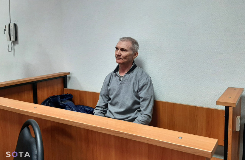  Russian citizen Alexei Moskalyov, who is accused of discrediting the country's armed forces in the course of Russia-Ukraine military conflict, attends a court hearing in the town of Yefremov in the Tula region, Russia, March 27, 2023.  (photo credit: SOTA/Handout via REUTERS)