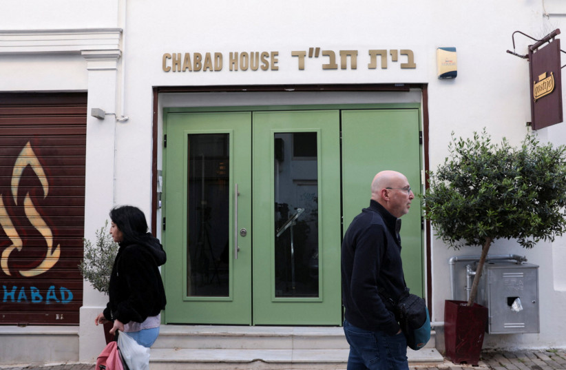  People walk past the entrance of an Israeli restaurant, following the arrest by Greek police of two suspected members of a group that was planning an attack against the restaurant, in Athens, Greece, March 29, 2023. (photo credit: Louiza Vradi/Reuters)