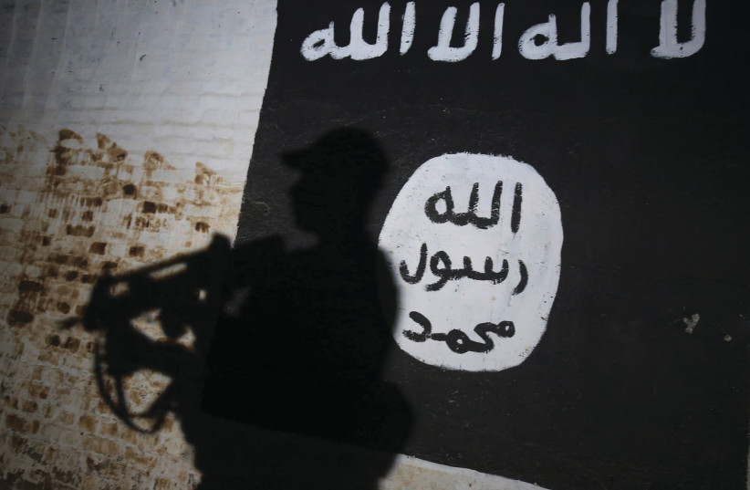  ISRAELI CYBER firm NSO Group stopped various ISIS-planned attacks in Europe.  (photo credit: Ahmad al-Rubaye/AFP via Getty Images)
