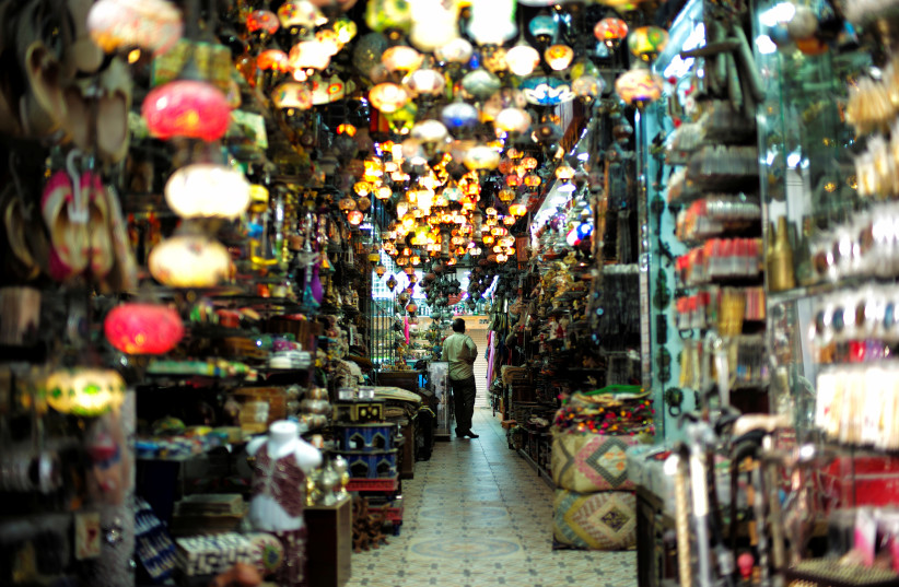  A visitor looks at traditional light-shop in local souq at Bab al Bahrain in Manama, Bahrain June 27, 2018.  (photo credit: HAMAD I MOHAMMED/REUTERS)