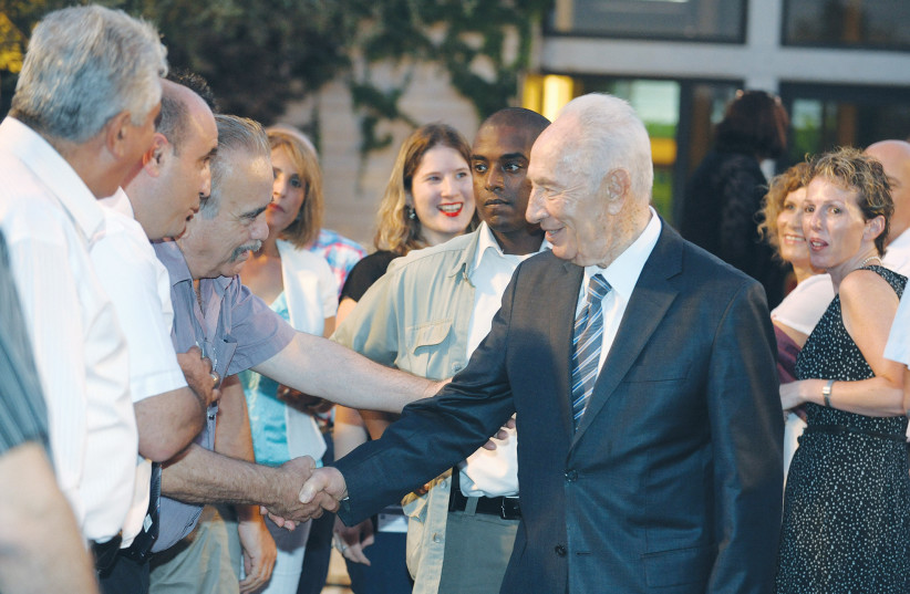  PRESIDENT SHIMON PERES hosts a festive dinner to break the Ramadan fast (iftar) with Muslim leaders and public figures, at the President’s Residence in Jerusalem in 2012.  (photo credit: MARK NEYMAN/GPO)