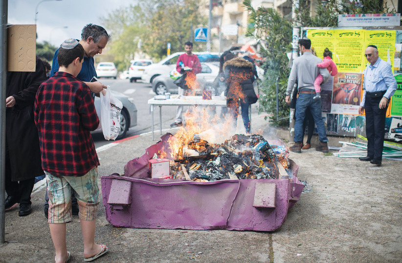  BURNING HAMETZ in Jerusalem before the start of Passover.  (photo credit: HADAS PARUSH/FLASH90)