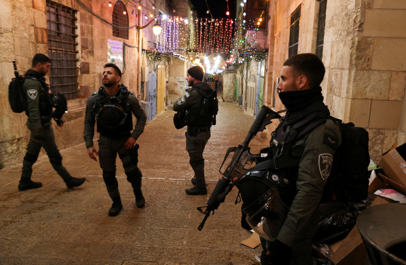  Israeli police stand guard near a security incident scene near Al-Aqsa compound also known to Jews as the Temple Mount, in Jerusalem's Old City, April 1, 2023.  (photo credit: REUTERS/AMMAR AWAD)