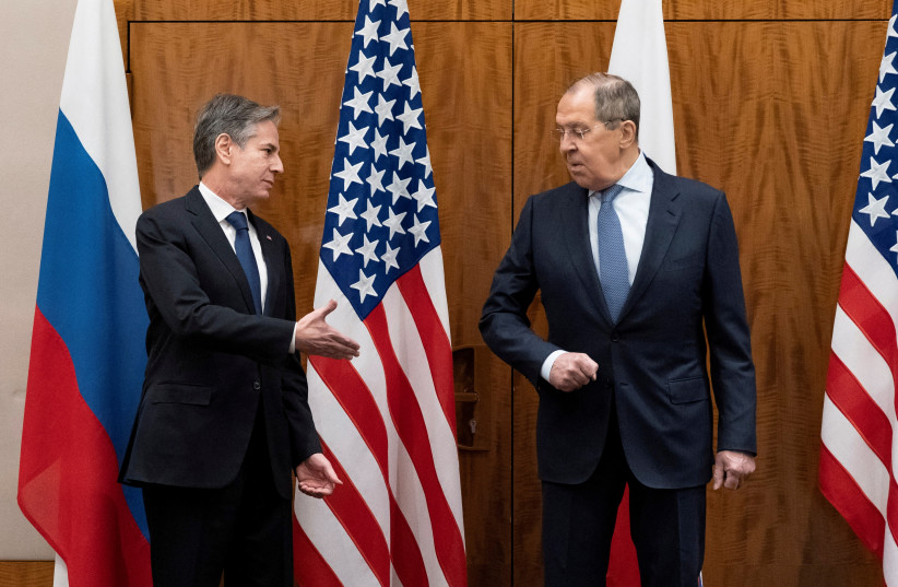  U.S. Secretary of State Antony Blinken greets Russian Foreign Minister Sergei Lavrov before their meeting, in Geneva, Switzerland, January 21, 2022 (photo credit: REUTERS)