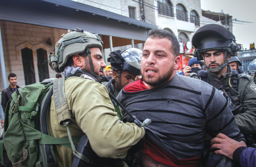  ISRAELI FORCES detain a Palestinian, during a protest in Huwara, last week. Maybe now that Israelis fear for their democracy, they might start thinking about what their government has done to the Palestinians, says the writer. (photo credit: NASSER ISHTAYEH/FLASH90)
