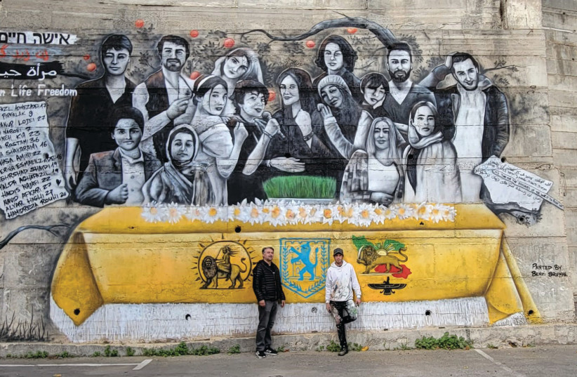  HOOMAN KHALILI (left) and Benzi Broffman, an Israeli graffiti artist, pose in front of the mural in Nazareth. (photo credit: Courtesy, Hooman Khalili)