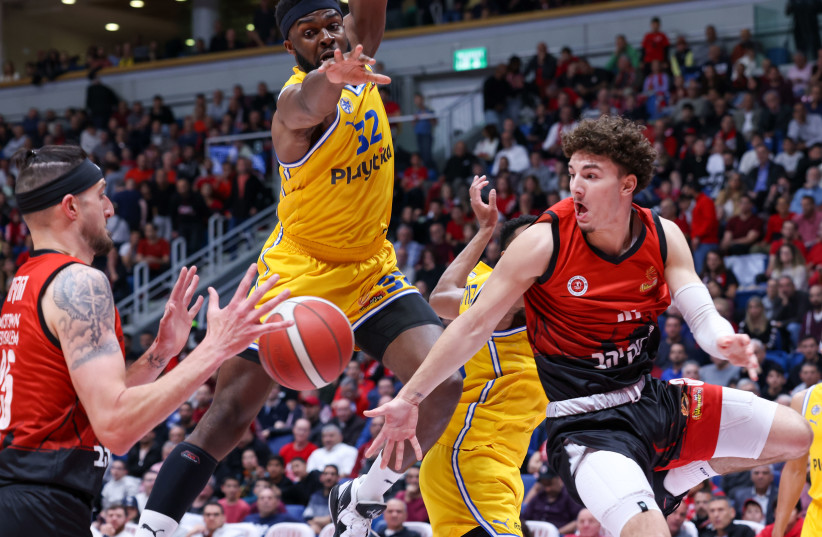  JOSH NEBO (center) and Maccabi Tel Aviv were too strong for host Hapoel Jerusalem on Sunday night, handing the Reds an 88-74 defeat in local league action. (credit: DANNY MARON)