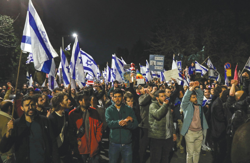  ISRAELIS MOBILIZE, blasting Netanyahu for announcing he the firing of Yoav Gallant. Yet the violence was minimal. Score one for the protesters, says the writer.  (photo credit: NOAM REVKIN FENTON/FLASH90)