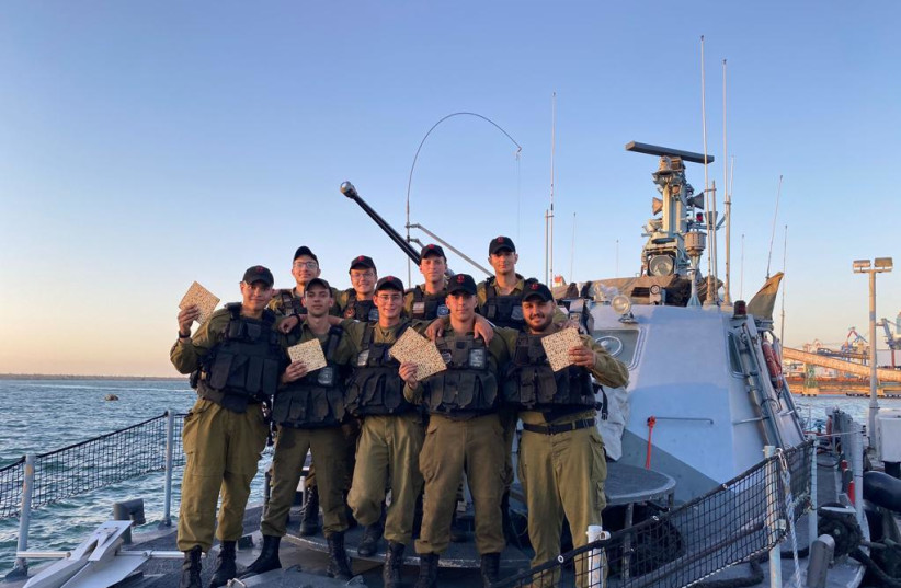  IDF soldiers are seen holding matzah ahead of the Passover holiday. (photo credit: IDF SPOKESPERSON'S UNIT)