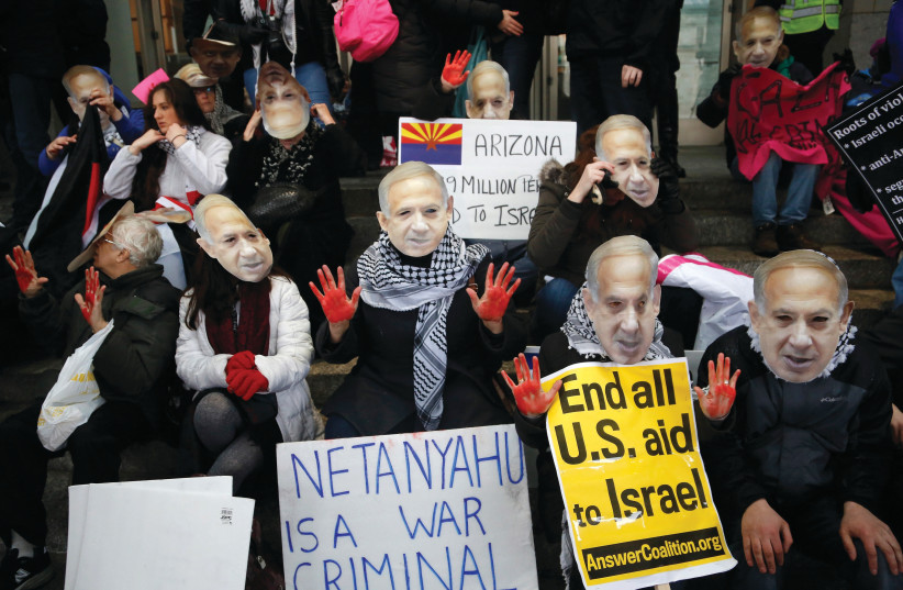  ANTI-ISRAEL demonstrators protest the 2015 AIPAC policy conference in Washington. Israel seems to be an ongoing deeply divisive issue in the US. (photo credit: JONATHAN ERNST/REUTERS)