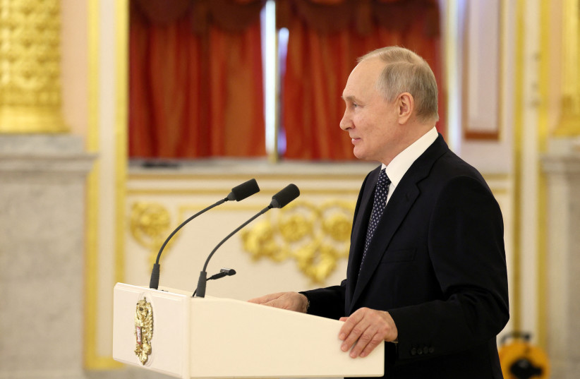 Russian President Vladimir Putin delivers a speech during a ceremony to receive diplomatic credentials from newly appointed foreign ambassadors at the Alexander Hall of the Grand Kremlin Palace in Moscow, Russia, April 5, 2023.  (photo credit: SPUTNIK/GAVRIIL GRIGOROV/KREMLIN VIA REUTERS)