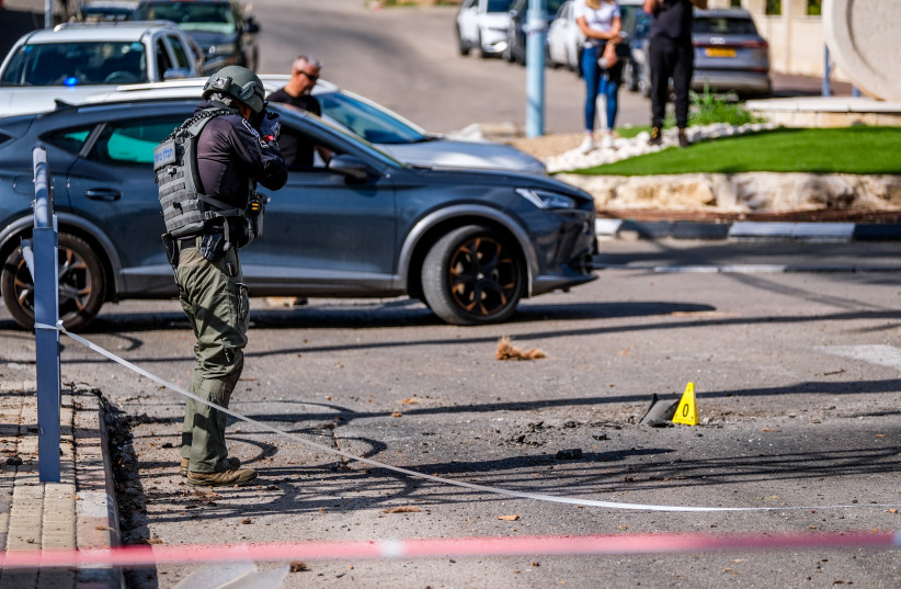 Israeli security at the scene where a missile fired from Lebanon hit the northern Israeli town of Shlomi, April 6, 2023 (photo credit: FLASH90/FADI AMUN)