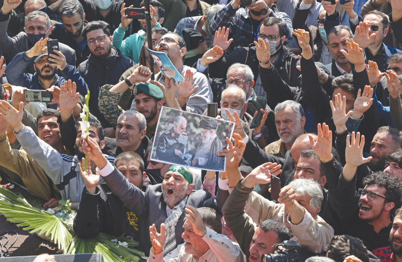  MOURNERS ATTEND the Tehran funeral procession for two of Iran’s revolutionary guard forces alledgdly killed by an Israeli air raid in Syria. (photo credit: Atta Kenare/AFP via Getty Images)