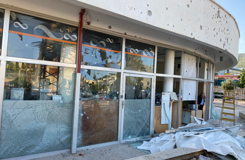  Damage done by a rocket attack at a local bank in Shlomi, April 6, 2023. (photo credit: SETH J. FRANTZMAN)
