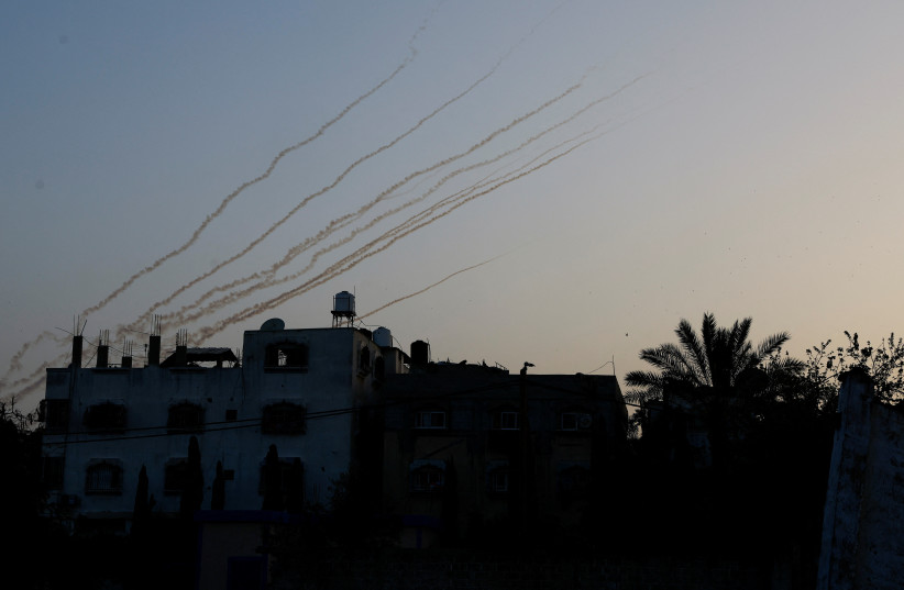  Streaks are seen in the sky as rockets are launched from Gaza, April 7, 2023. (photo credit: MOHAMMED SALEM/REUTERS)