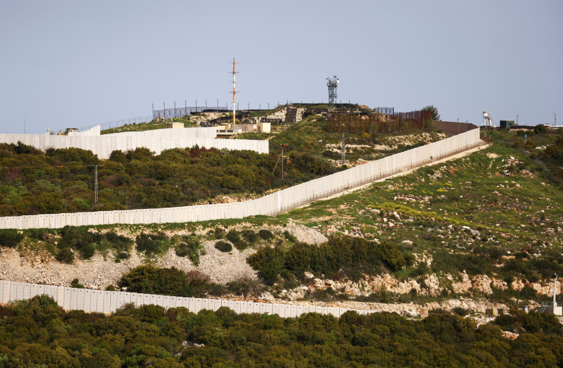  A concrete border fence can be seen between Israel and Lebanon from its Israel's side near Shtula, northern Israel April 7, 2023.  (credit: RONEN ZVULUN/REUTERS)