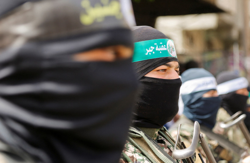  Palestinian militants attend Hamas rally Solidarity with Al-Aqsa in Jabalia, northern Gaza April 7, 2023 (photo credit: REUTERS/AARAFAT BARBAKH)